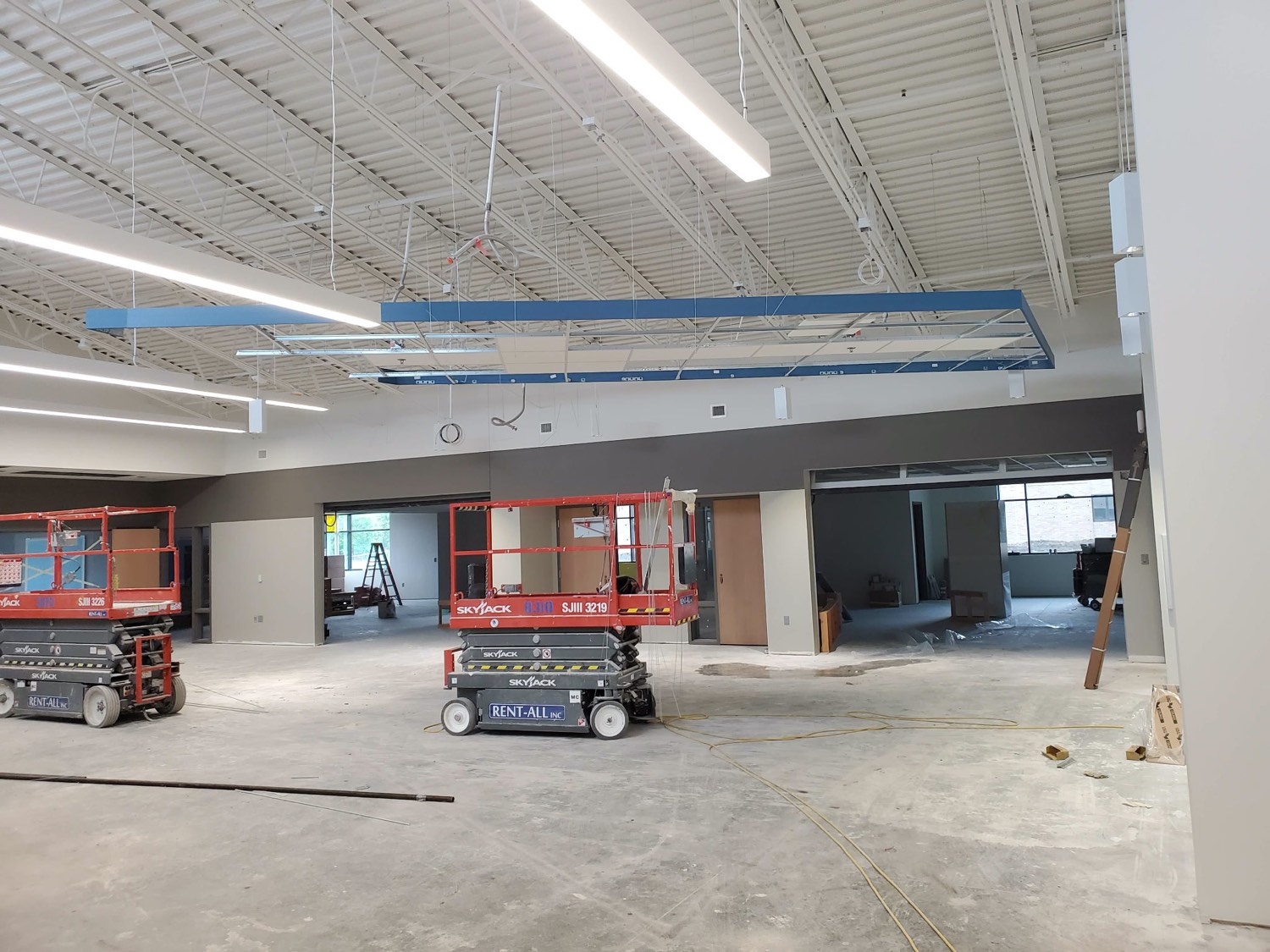 Blue acoustic baffle frame on a commercial build-out ceiling by Skampy Acoustical
