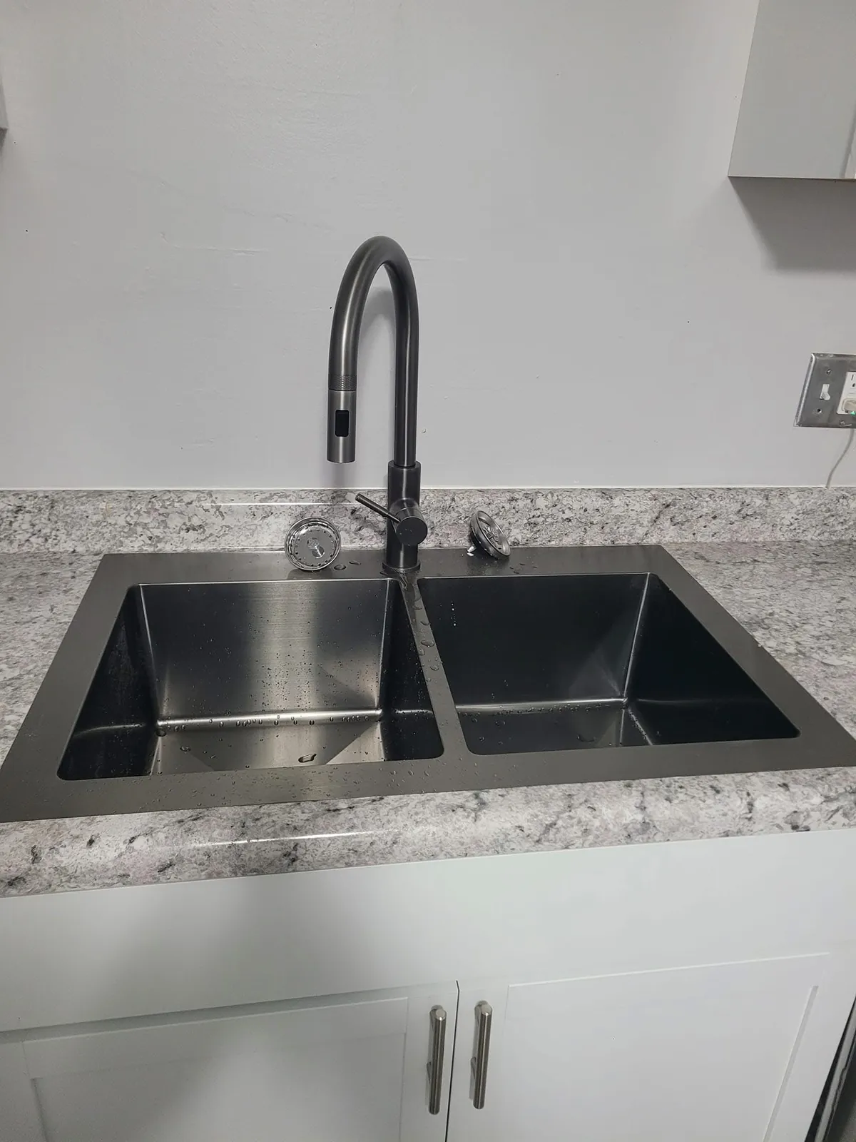 New kitchen sink and granite-look counters installed by Skampy Construction, Sioux Falls SD