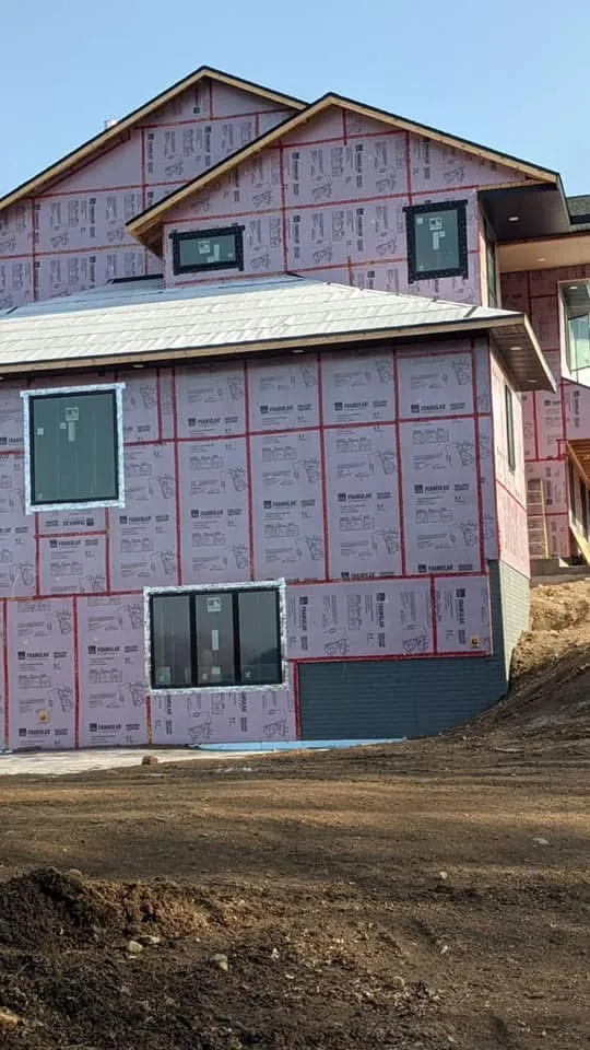 New two-story home under construction with insulated exterior sheathing