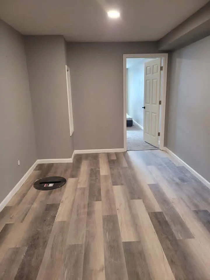 Finished basement living space with vinyl plank flooring in Sioux Falls, SD