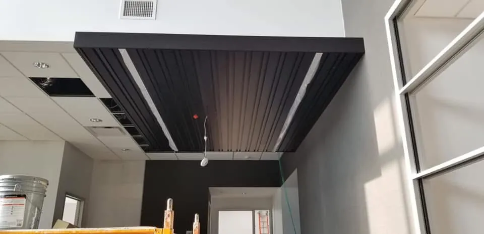 Black wood slat feature ceiling on a commercial project