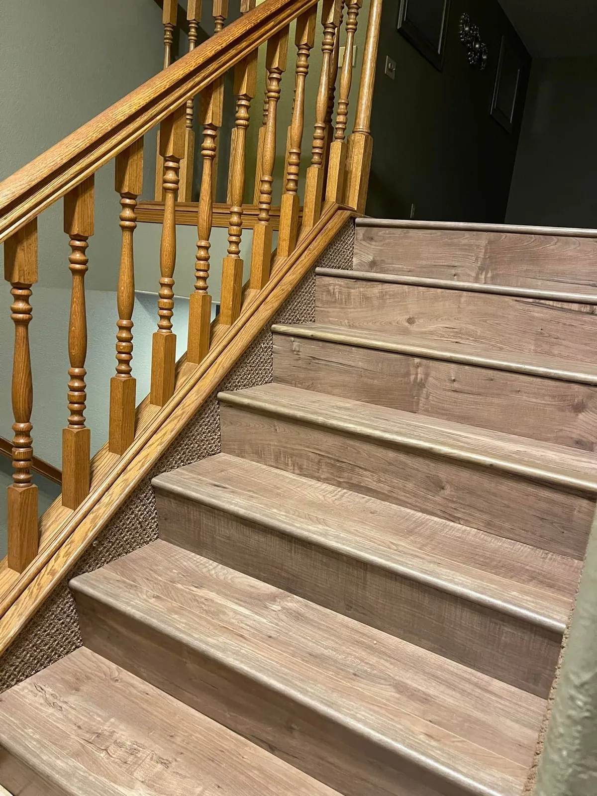 Vinyl plank flooring installed on a staircase by Skampy Construction, Sioux Falls SD